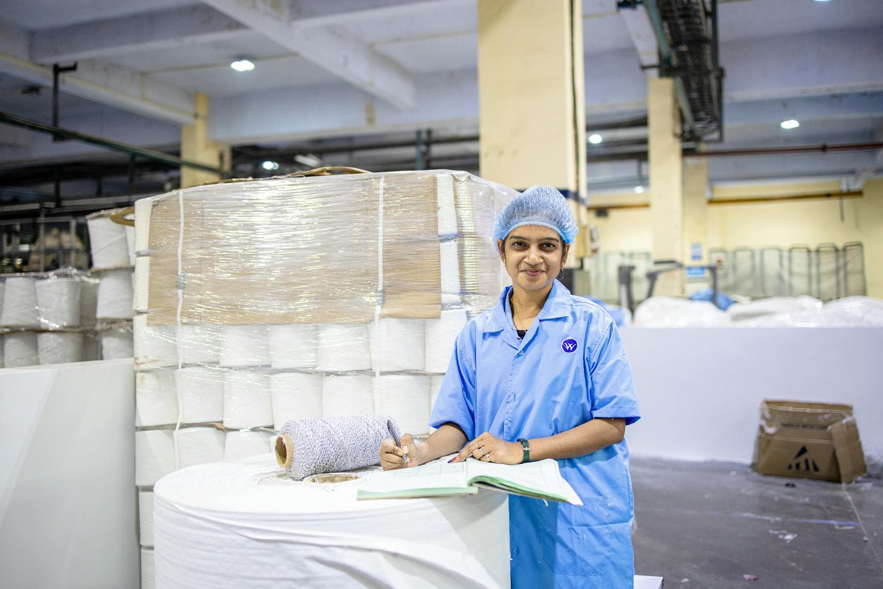 Factory worker checking production materials